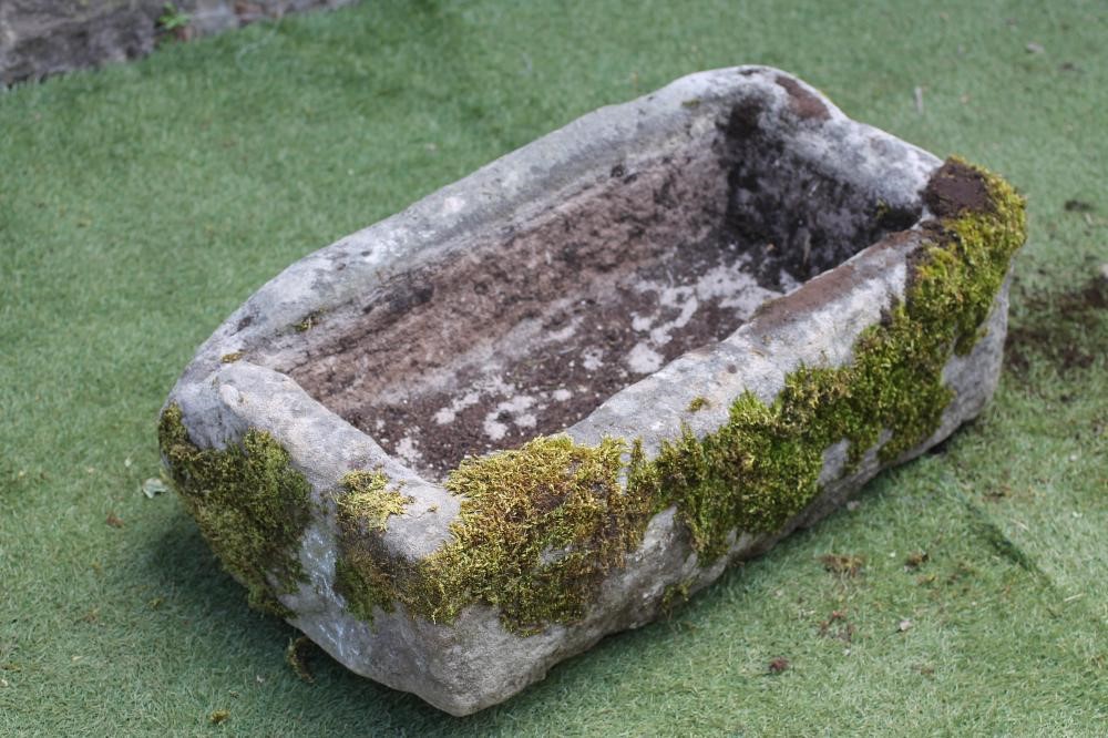 A SANDSTONE TROUGH of rough hewn oblong form Image