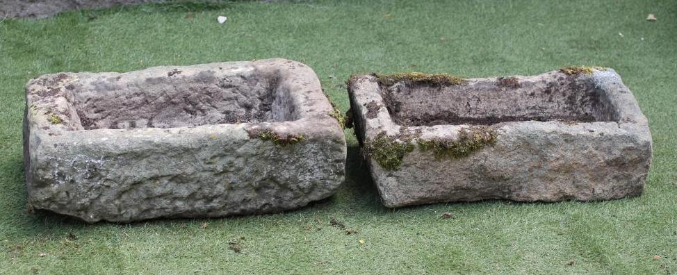 A SMALL SANDSTONE TROUGH of rough hewn oblong form Image