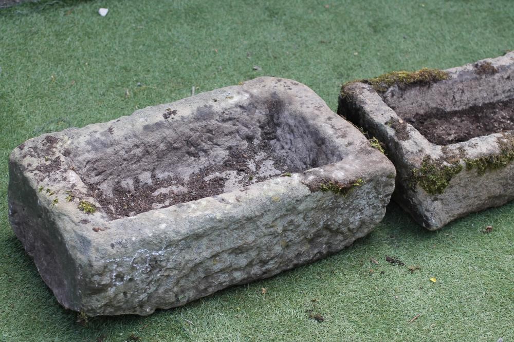 A SMALL SANDSTONE TROUGH of rough hewn oblong form Image