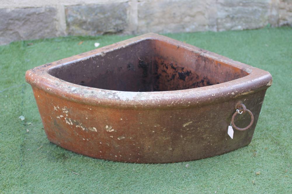 A SALTGLAZE STONEWARE QUADRANT TROUGH with moulded rim and applied with a metal ring Image