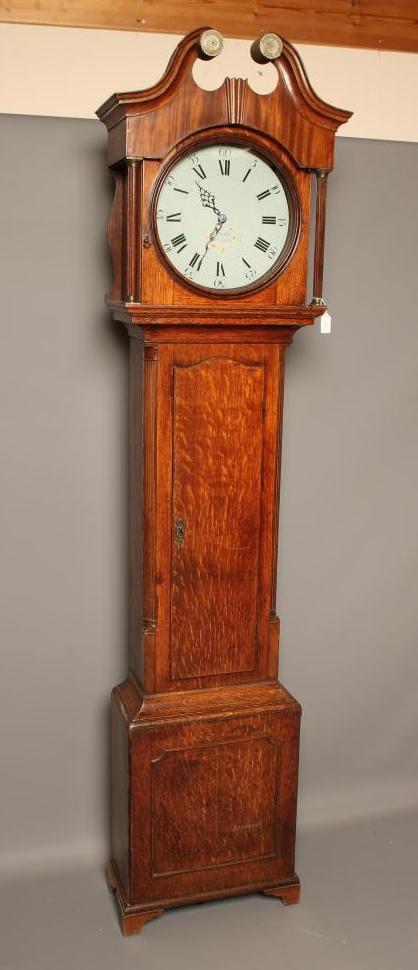 AN OAK LONGCASE CLOCK signed W. Condliffe Image