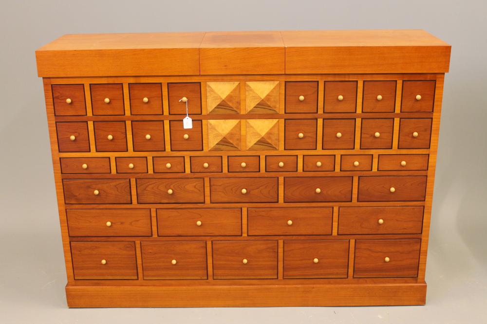 A CHERRY WOOD ARCHITECTURAL DRINKS CABINET by the Italian maker Sellaro Image