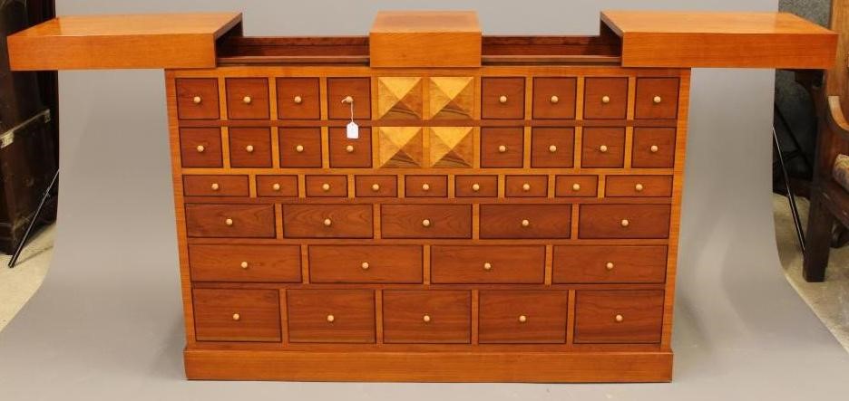 A CHERRY WOOD ARCHITECTURAL DRINKS CABINET by the Italian maker Sellaro Image