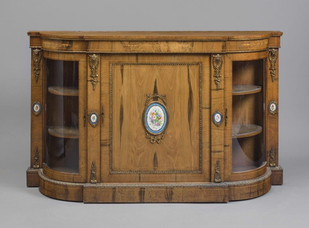 A VICTORIAN WALNUT CREDENZA of D form with stringing and with gilt metal mounts inset with Sevres Image
