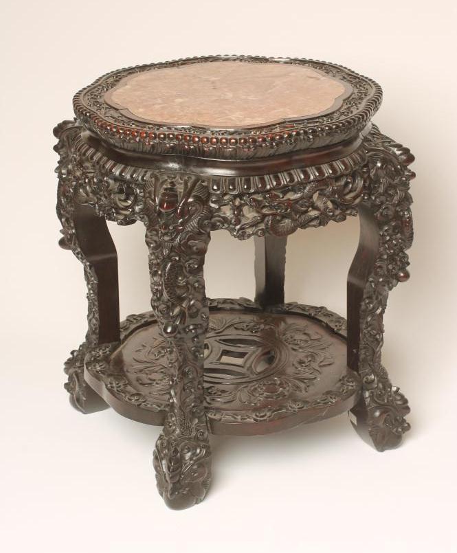 A CHINESE CARVED PADOUK WOOD JARDINIERE STAND Image