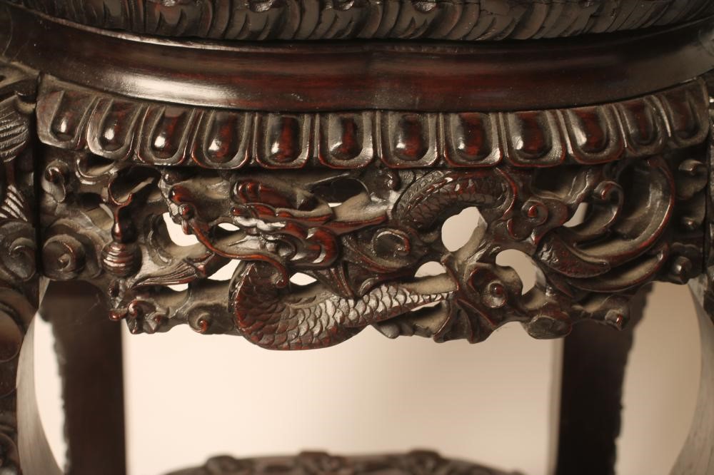A CHINESE CARVED PADOUK WOOD JARDINIERE STAND Image