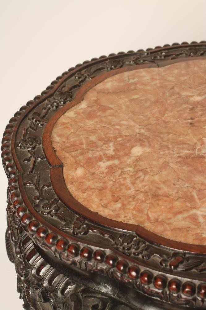 A CHINESE CARVED PADOUK WOOD JARDINIERE STAND Image