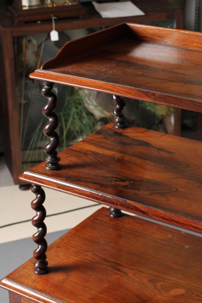 AN EARLY VICTORIAN ROSEWOOD MUSIC CABINET of oblong form with upper section of two graduated open Image