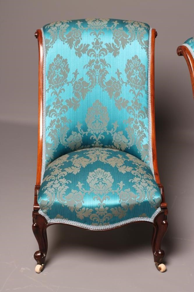 A PAIR OF VICTORIAN ROSEWOOD SALON CHAIRS of Grecian form upholstered in turquoise silk brocade Image