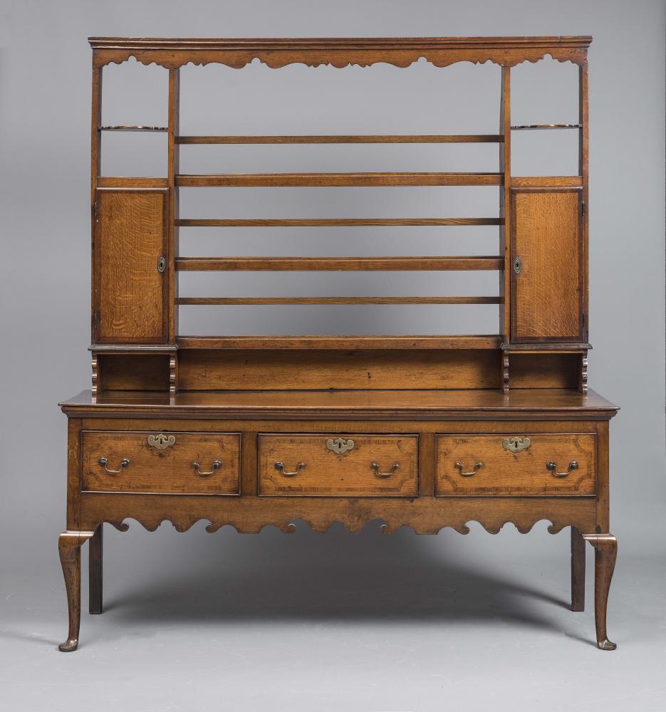 A GEORGIAN OAK AND MAHOGANY BANDED DRESSER Image