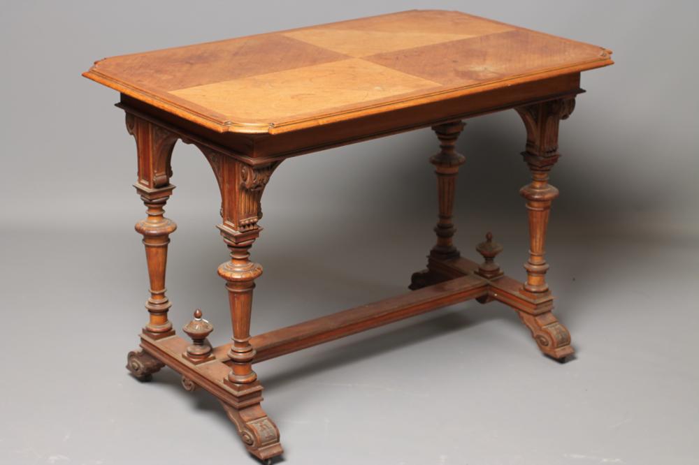 A CARVED OAK AND PARCEL GILT LIBRARY TABLE Image