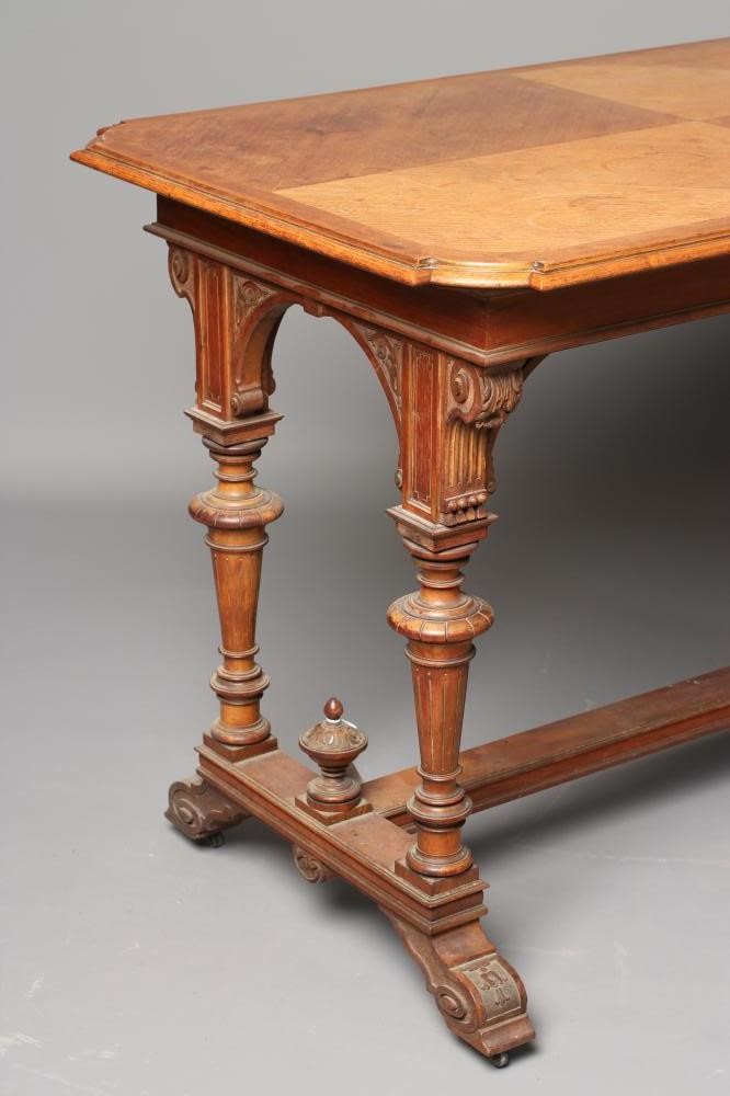 A CARVED OAK AND PARCEL GILT LIBRARY TABLE Image