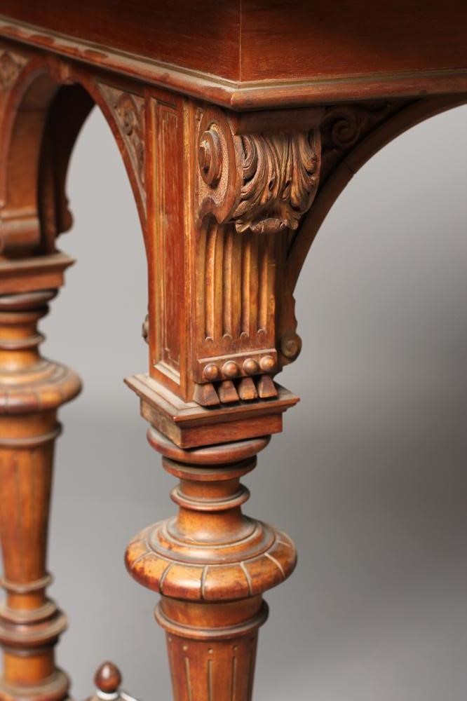 A CARVED OAK AND PARCEL GILT LIBRARY TABLE Image