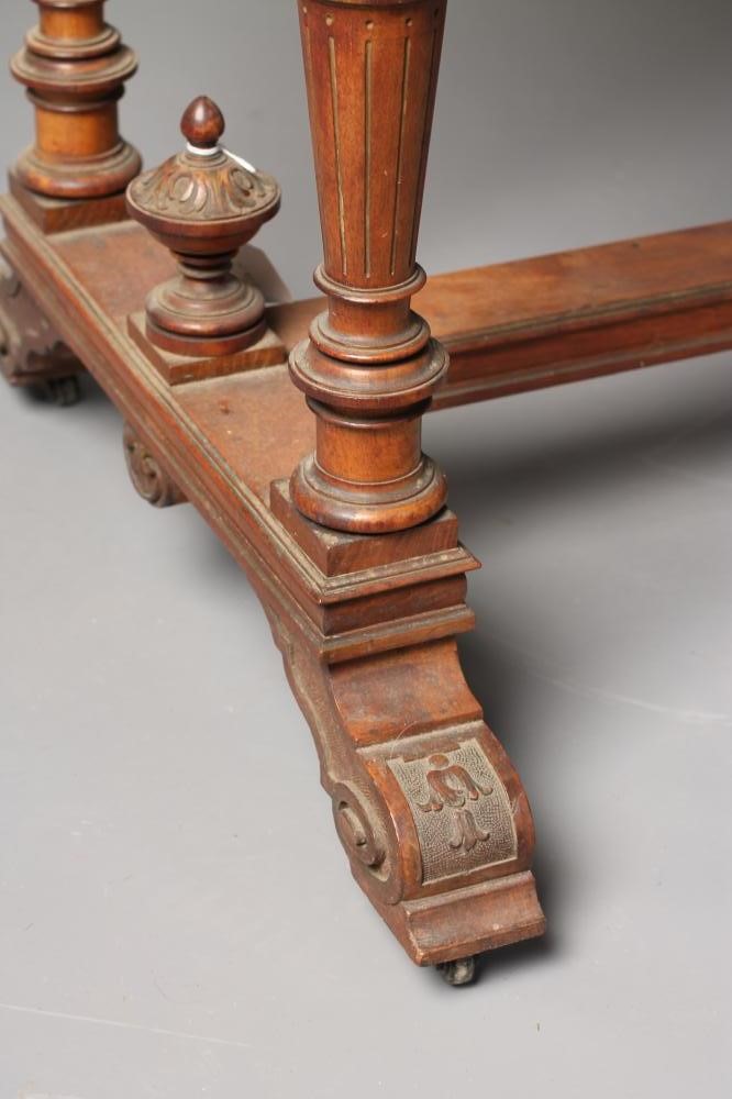 A CARVED OAK AND PARCEL GILT LIBRARY TABLE Image