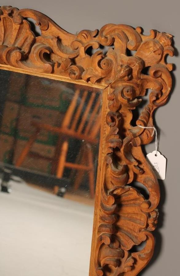 A CARVED AND PAINTED PINE WALL MIRROR Image