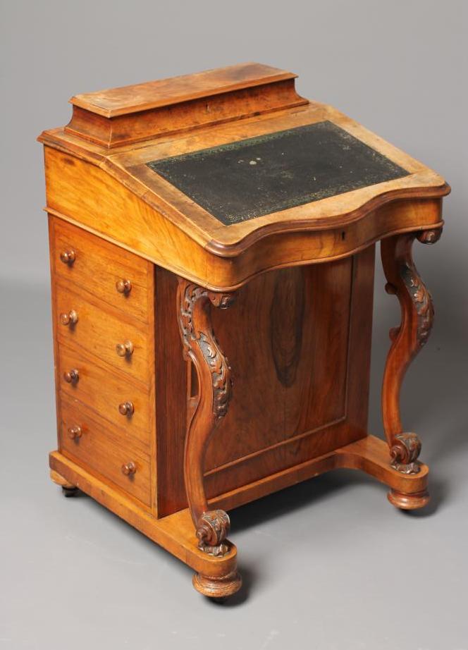 A VICTORIAN WALNUT DAVENPORT Image