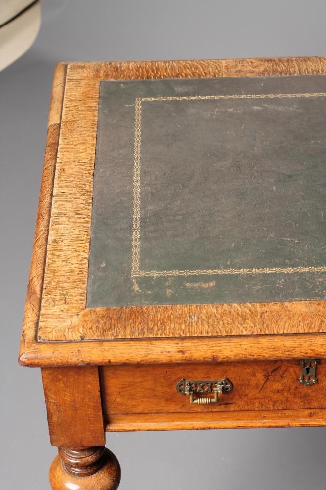 A VICTORIAN POLLARD OAK WRITING TABLE Image