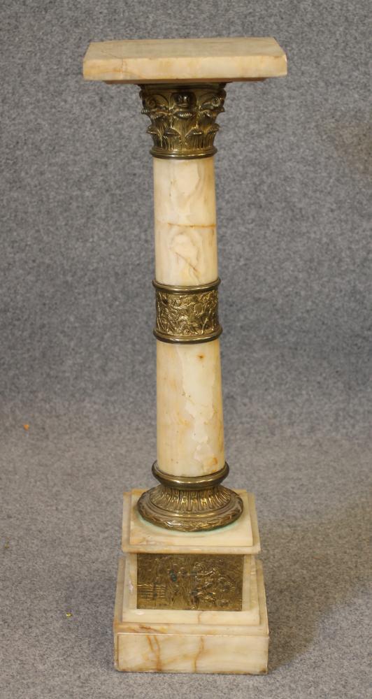 A VEINED WHITE ONYX AND GILT METAL PEDESTAL Image