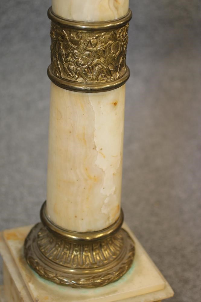 A VEINED WHITE ONYX AND GILT METAL PEDESTAL Image