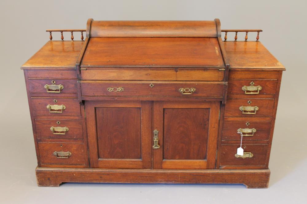 A LATE VICTORIAN WALNUT "BRADFORD DESK LIBRARY VERSION" by Christopher Pratt & Sons Image