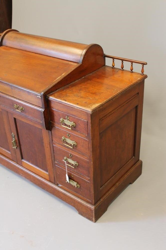 A LATE VICTORIAN WALNUT "BRADFORD DESK LIBRARY VERSION" by Christopher Pratt & Sons Image