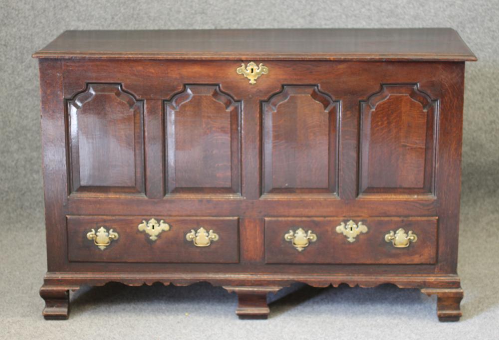 AN OAK PANELLED CHEST Image