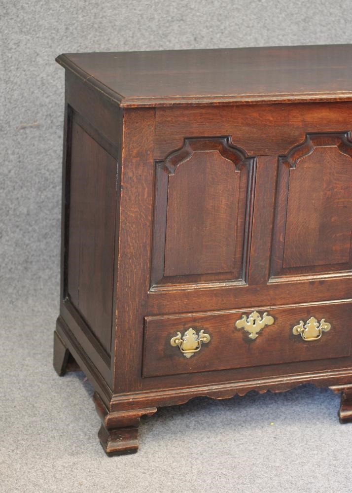 AN OAK PANELLED CHEST Image