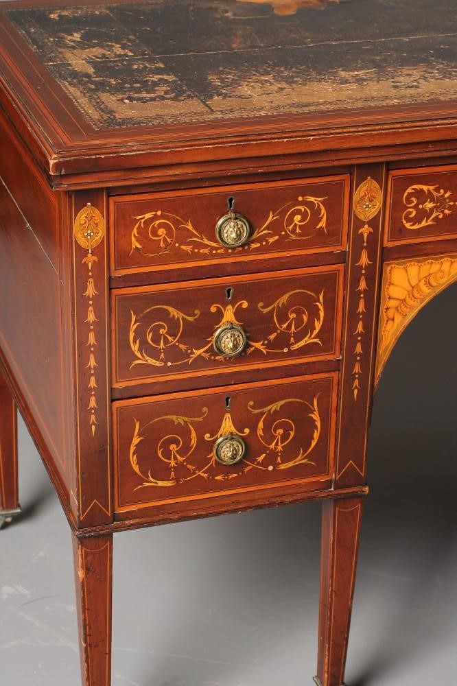 AN EDWARDIAN MAHOGANY AND FOLIATE MARQUETRY DESK of oblong form crossbanded with stringing Image
