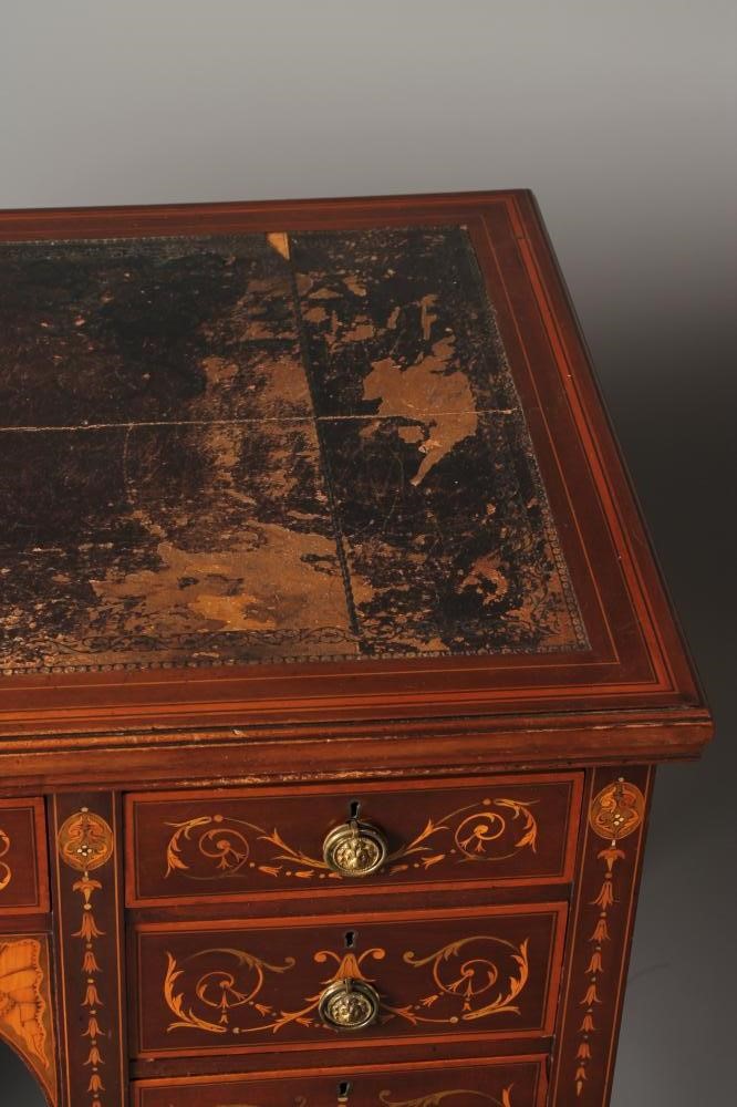 AN EDWARDIAN MAHOGANY AND FOLIATE MARQUETRY DESK of oblong form crossbanded with stringing Image