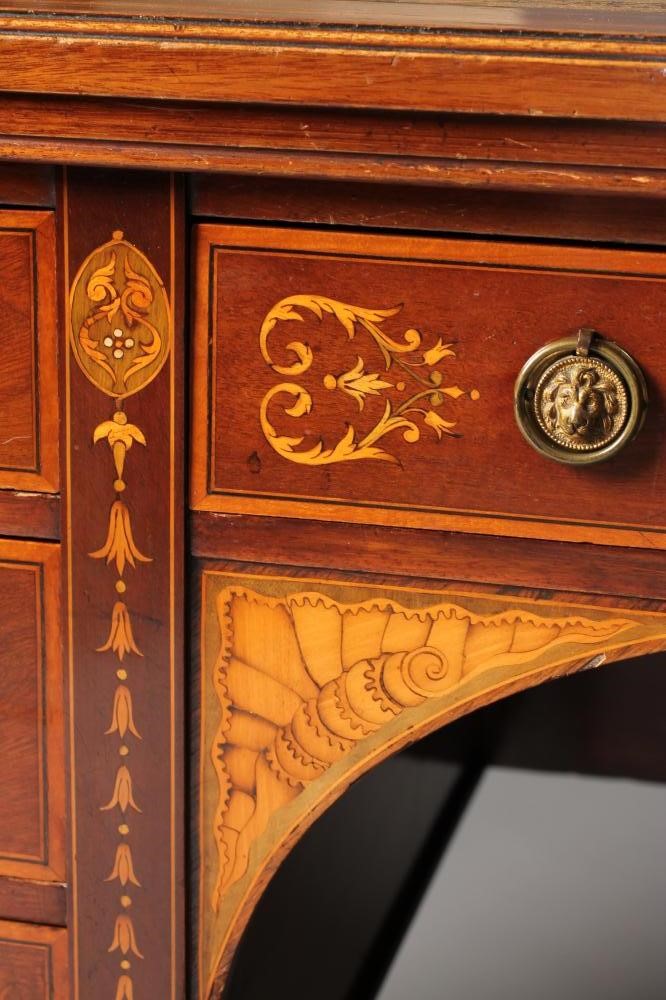 AN EDWARDIAN MAHOGANY AND FOLIATE MARQUETRY DESK of oblong form crossbanded with stringing Image