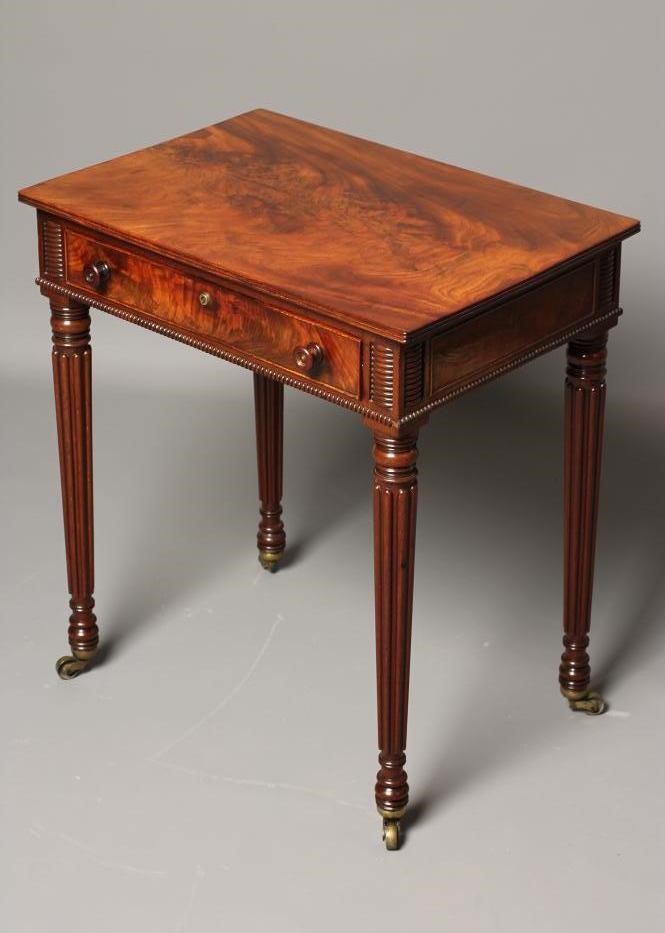 A SMALL MAHOGANY WRITING TABLE Image