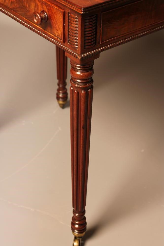 A SMALL MAHOGANY WRITING TABLE Image