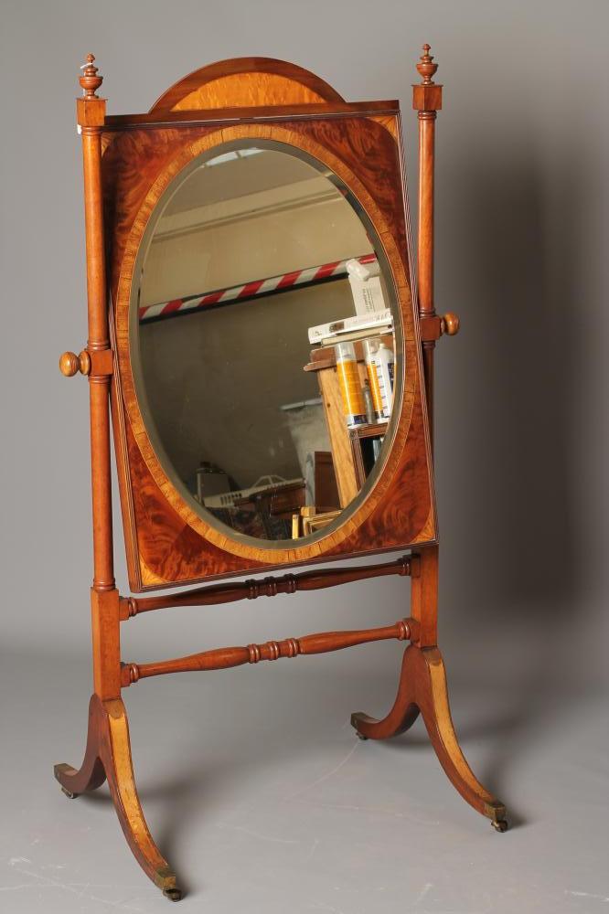 A MAHOGANY CHEVAL MIRROR Image