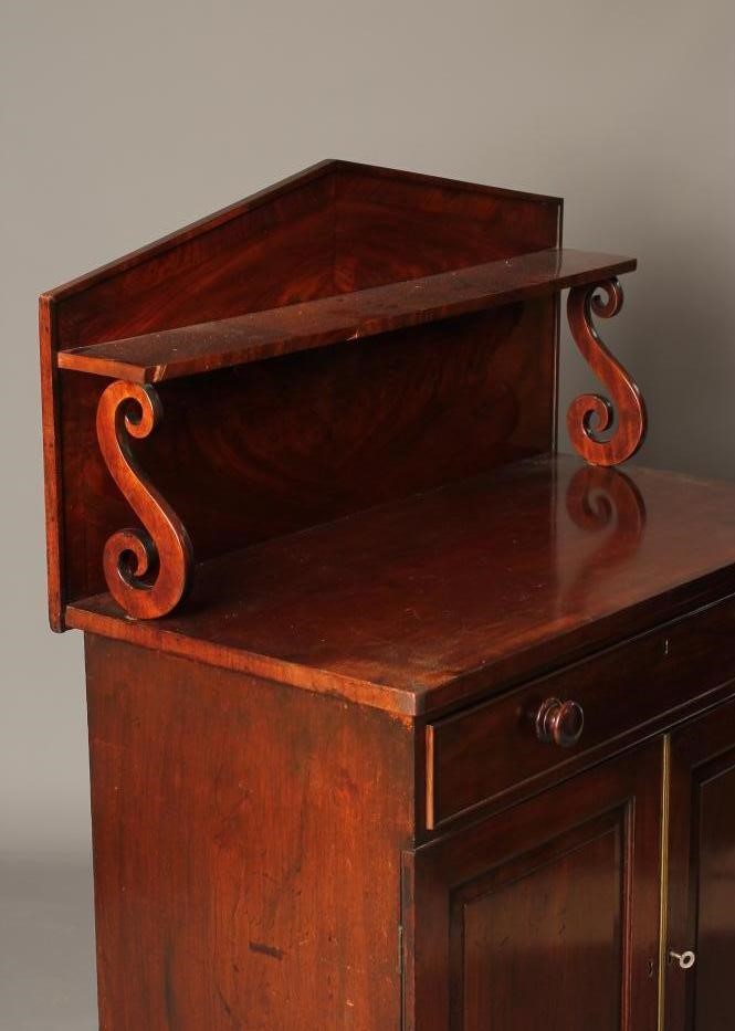 A MAHOGANY AND BANDED CHIFFONIER Image