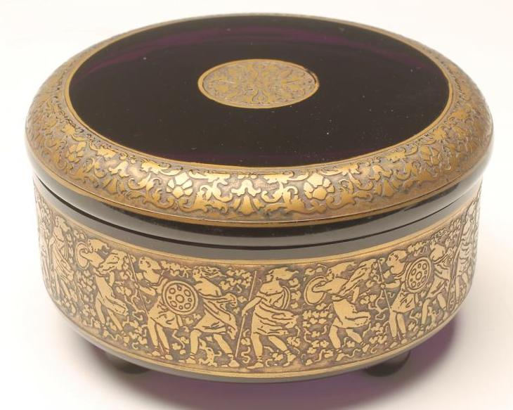 A MOSER AMETHYST GLASS POWDER BOX AND COVER of cylindrical form raised upon four ball feet Image