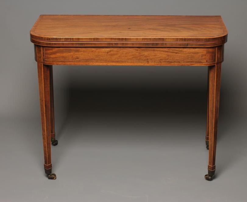 A GEORGIAN MAHOGANY FOLDING TEA TABLE Image