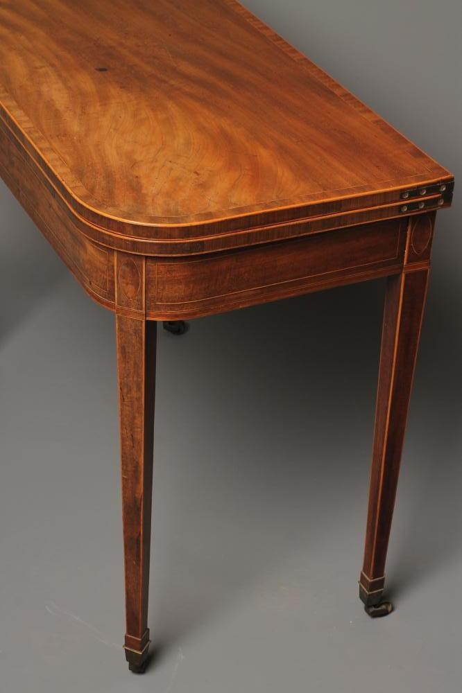 A GEORGIAN MAHOGANY FOLDING TEA TABLE Image