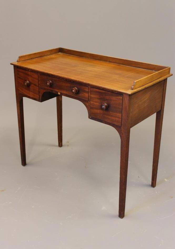 A MAHOGANY DRESSING TABLE Image