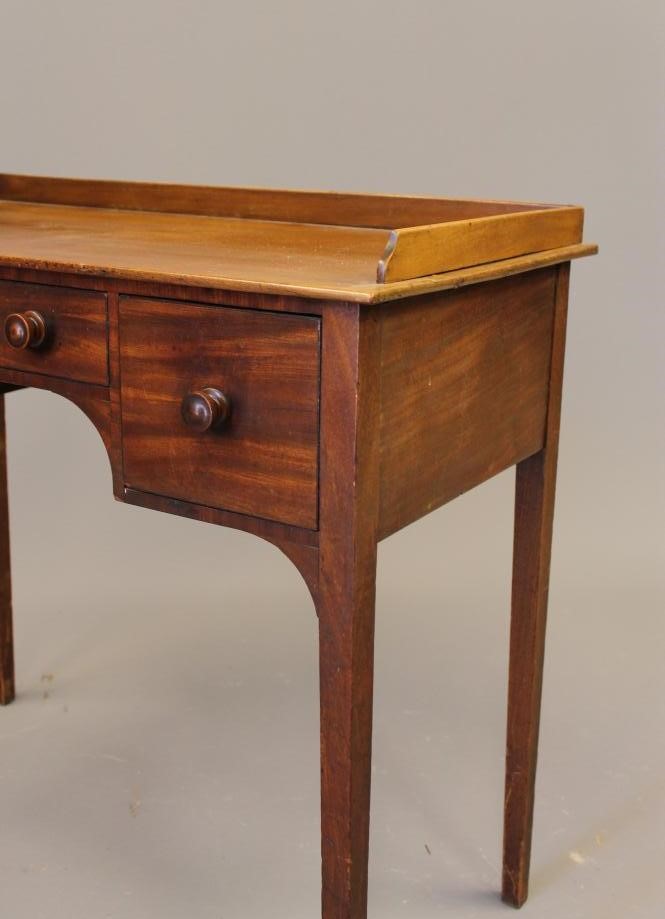 A MAHOGANY DRESSING TABLE Image