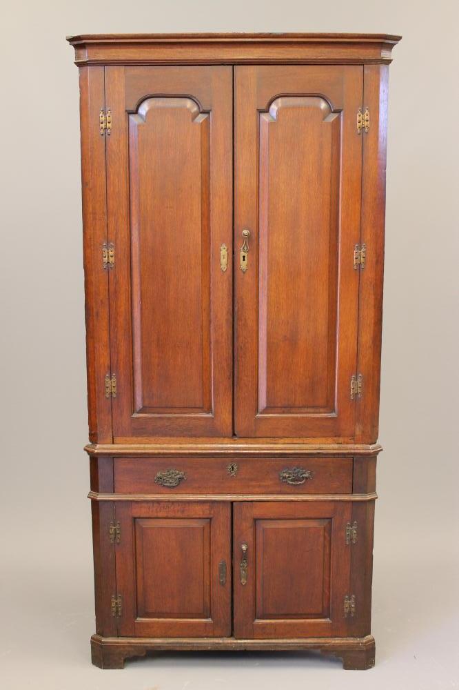 A GEORGIAN OAK STANDING CORNER CUPBOARD Image