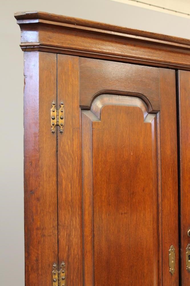 A GEORGIAN OAK STANDING CORNER CUPBOARD Image