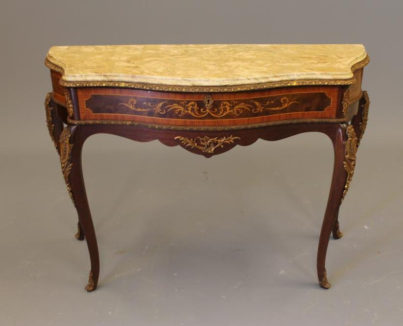 A LOUIS XV STYLE MAHOGANY SIDE TABLE of serpentine outline with marquetry inlay Image