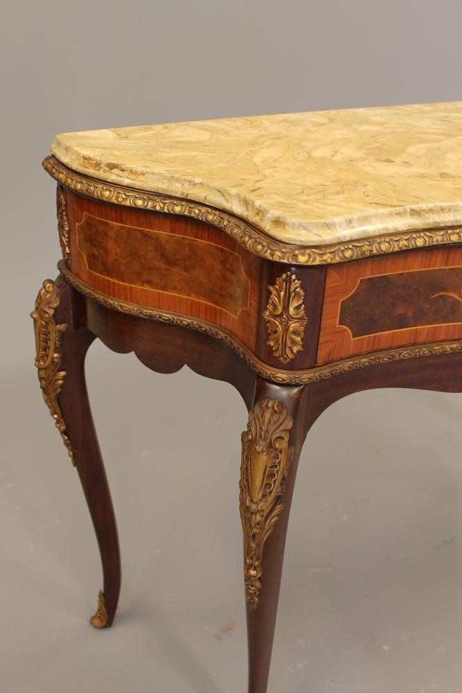 A LOUIS XV STYLE MAHOGANY SIDE TABLE of serpentine outline with marquetry inlay Image
