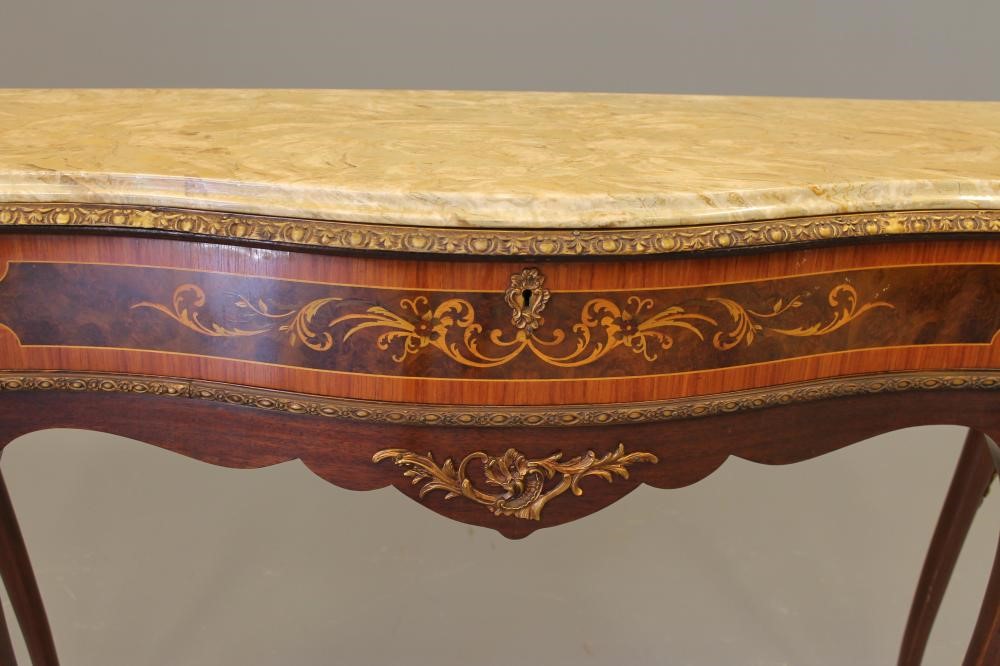 A LOUIS XV STYLE MAHOGANY SIDE TABLE of serpentine outline with marquetry inlay Image