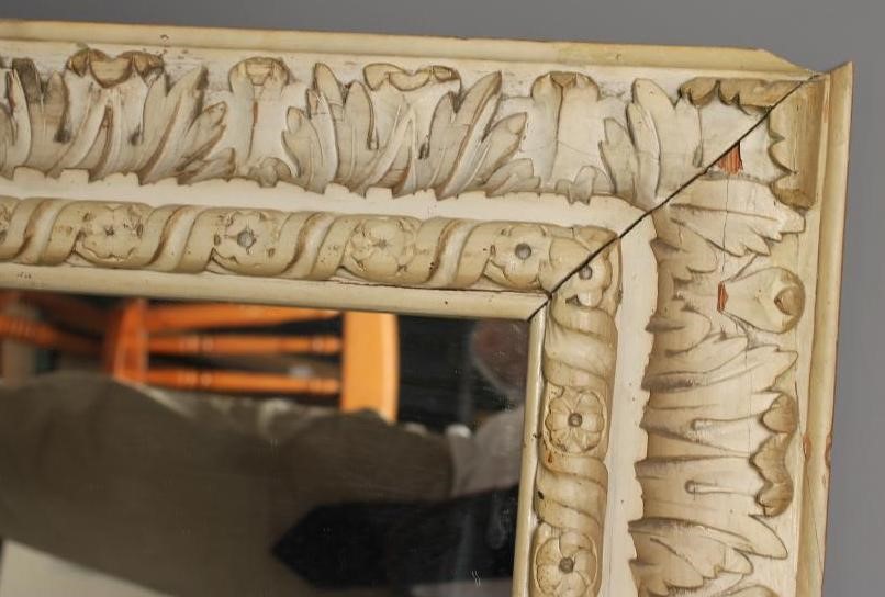 A CARVED LIME WOOD WALL MIRROR Image