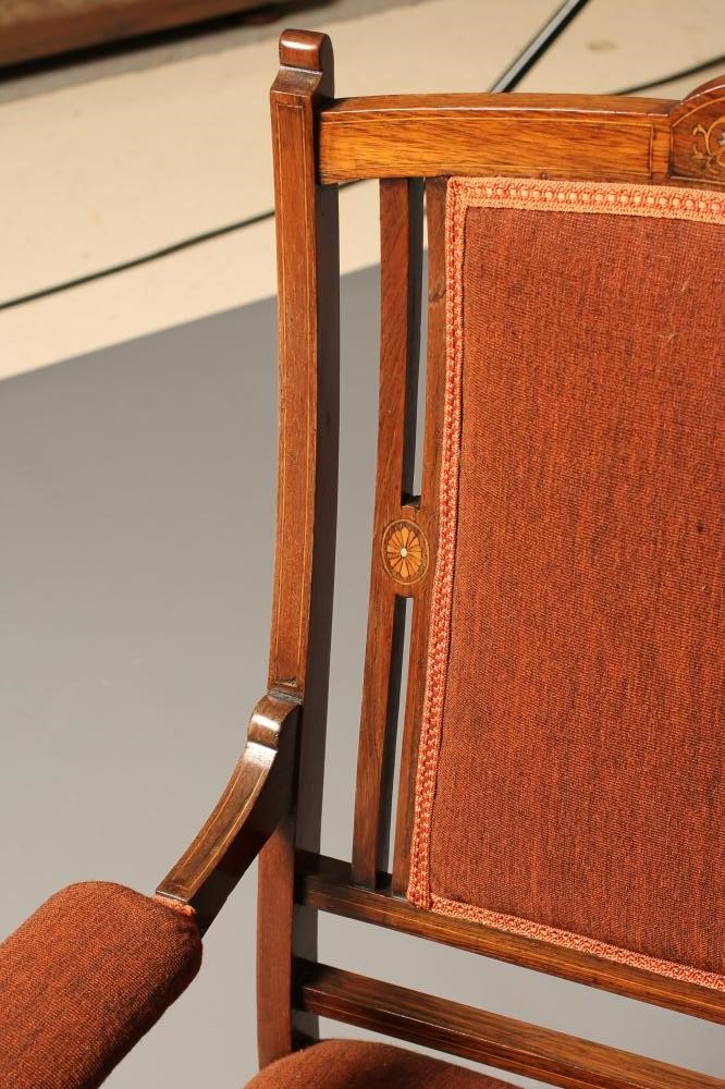 AN EDWARDIAN ROSEWOOD FRAMED ARMCHAIR with stringing and upholstered in a rust coloured weave Image