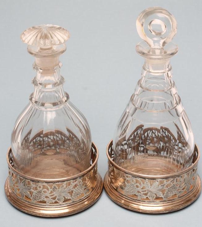 A PAIR OF PLATED ON COPPER BOTTLE COASTERS of plain cylindrical form Image