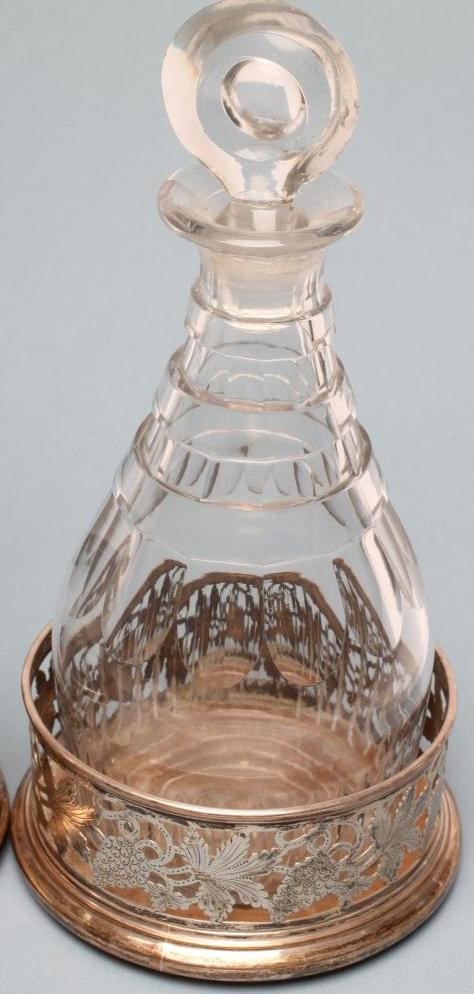 A PAIR OF PLATED ON COPPER BOTTLE COASTERS of plain cylindrical form Image