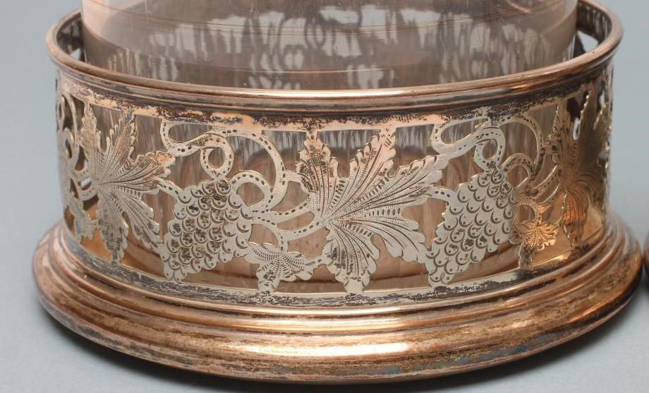 A PAIR OF PLATED ON COPPER BOTTLE COASTERS of plain cylindrical form Image