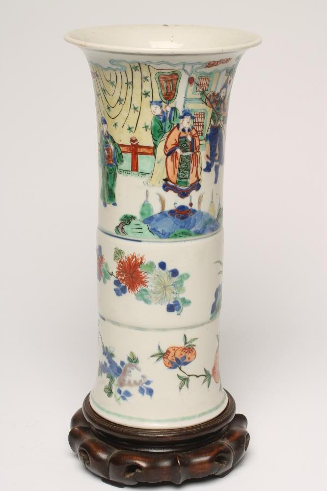 A CHINESE PORCELAIN BEAKER VASE painted in famille verte enamels with figures over fruiting peach Image